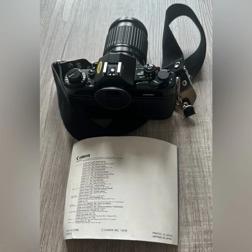 Canon A-1 Black SLR with Pamphlet and Strap